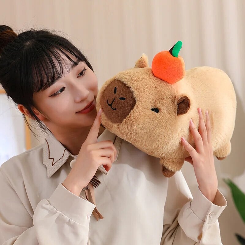 Cute Sleepy Capybara with Orange Plushie