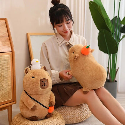 Cute Sleepy Capybara with Orange Plushie