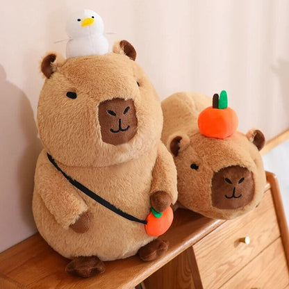 Cute Sleepy Capybara with Orange Plushie