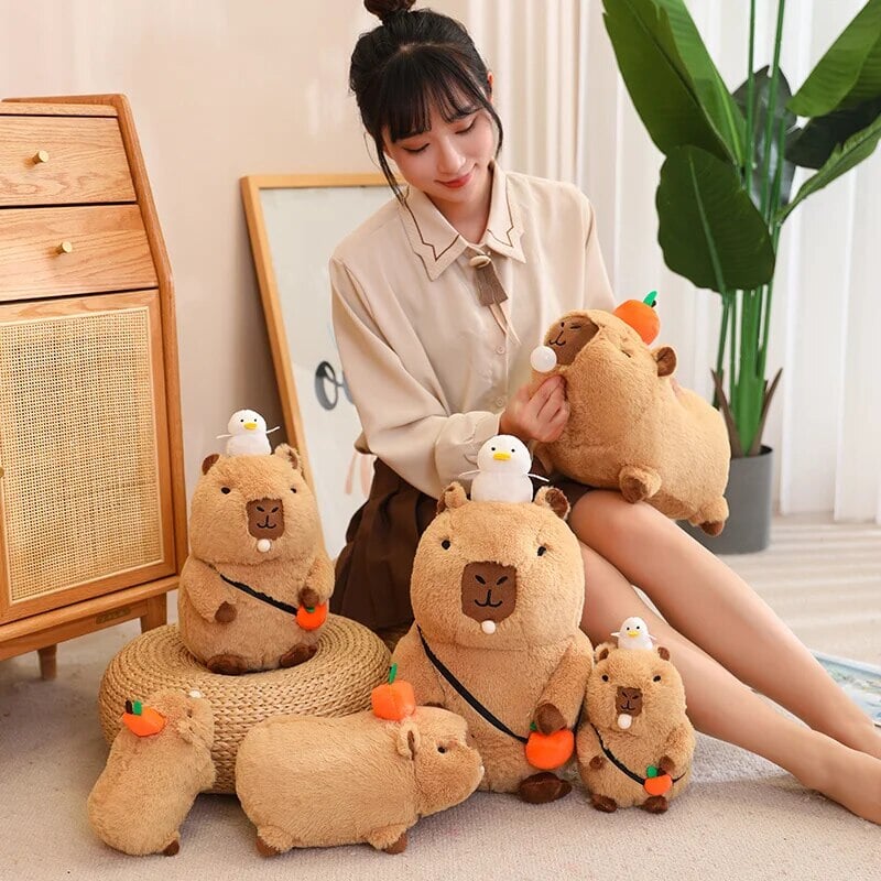 Cute Sleepy Capybara with Orange Plushie