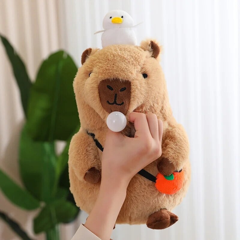 Cute Sleepy Capybara with Orange Plushie